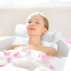 White suction-cup bath pillow shown in use in a bath