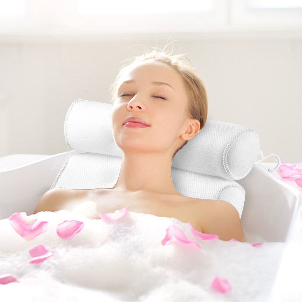 White suction-cup bath pillow shown in use in a bath