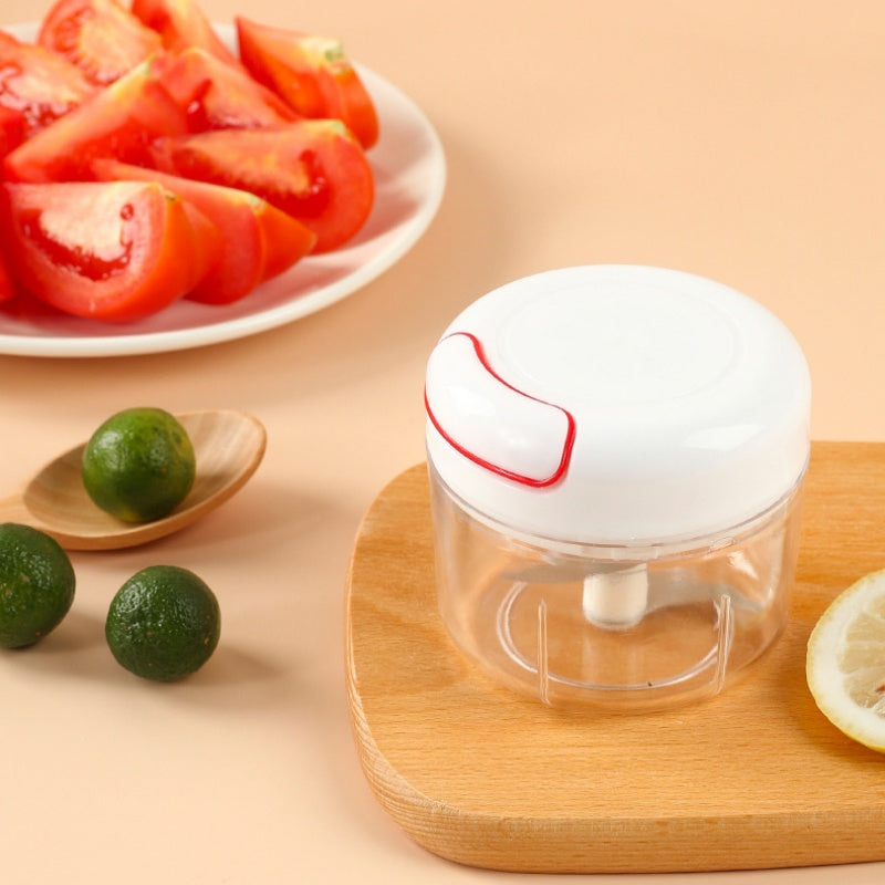 Mini Pull-Cord Food Chopper — Assorted Colour; colour supplied at random; usage illustration
