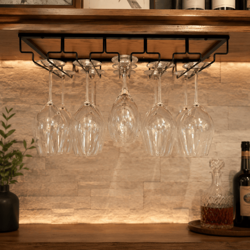 Five-slot black wine glass rack mounted beneath a shelf; glasses not included